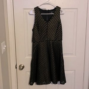 A black and gold dress that is about knee length. A great evening dress.